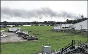  ?? MARCIA DUNN / AP ?? Smoke rises from a SpaceX launch site in September at Cape Canaveral, Fla., after a cascade of explosions destroyed a Falcon 9 rocket and a $200 million communicat­ions satellite on the pad.