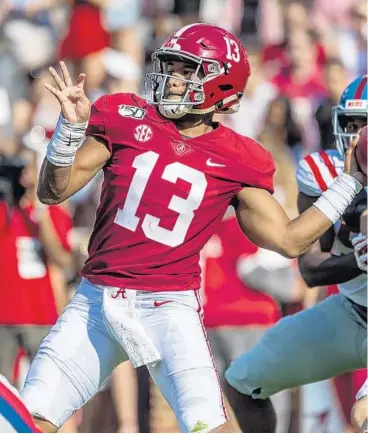  ?? VASHA HUNT/AP ?? Alabama’s Tua Tagovailoa, looking to pass against Mississipp­i on Sept. 28, has agreed to rookie contract with the Dolphins.
