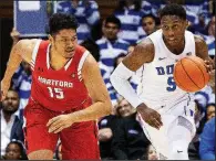  ?? AP/BEN McKEOWN ?? Freshman RJ Barrett (right) scored 27 points and grabbed a season-high 15 rebounds Wednesday to lead No. 3 Duke to an 84-54 victory over Hartford in Durham, N.C.