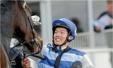  ??  ?? Taiki Yanagida is all smiles after winning on Sleeping Beauty at Tauranga yesterday.