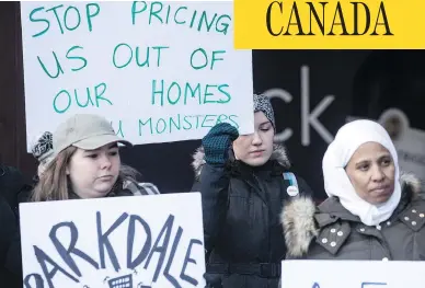  ?? PHOTOS: CHRIS YOUNG / THE CANADIAN PRESS ?? Rent strikers from a rental building at 1251 King Street West and fellow protesters gather in Toronto on Friday. The tenants are upset by a proposed rent increase of nearly double the legally permitted amount.