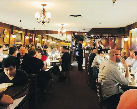  ??  ?? Murals of Italy, wood walls and menu items like giant meatballs propel diners to another era at Pepino’s Spaghetti House.