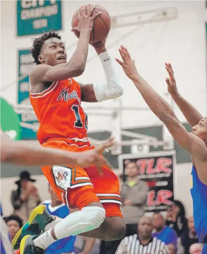  ?? | KEVIN TANAKA/ FOR THE SUN- TIMES ?? Morgan Park’s Ayo Dosunmu is the top junior in the state on the City/ Suburban Hoops Report’s latest list.