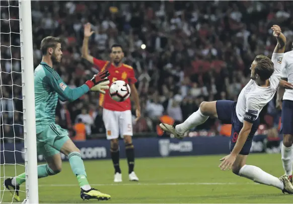  ??  ?? With David de Gea in goal, Spain kept Harry Kane and his England team at bay during their 2-1 victory at Wembley Stadium in London on Saturday