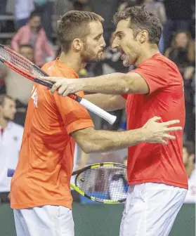  ?? Picture: EPA ?? VICTORY IS SWEET. Serbia’s Viktor Troicki and Nenad Zimonjic celebrate after winning their doubles tie.