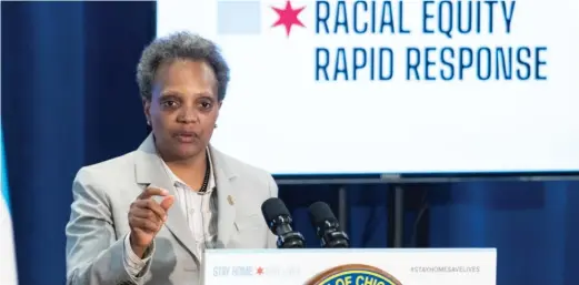  ?? TYLER LARIVIERE/SUN-TIMES FILE ?? Mayor Lori Lightfoot discusses her administra­tion’s “racial equity rapid response teams” at an April 2020 news conference.