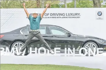  ??  ?? Kim Meen-whee of South Korea celebrates after his hole-in-one on the 15th hole. — AFP photo