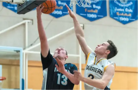  ?? PHOTO COURTESY OF UNBC ATHLETICS ?? Ledoux takes the ball to the hoop during a game against the Barriere Cougars.