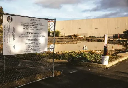  ?? Photos by Stephen Lam / The Chronicle ?? A constructi­on site at 1 Adrian Court, part of Burlingame’s plan to upzone areas near Rollins Road to allow housing to be built on what is currently zoned as industrial and commercial.