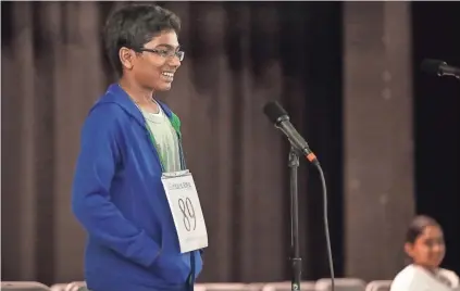  ?? PHOTOS BY JIM WEBER, THE COMMERCIAL APPEAL ?? Eighth-grader Samuel Paul reacts after spelling his final word correctly to win the Greater Memphis Spelling Bee at the Al Chymia Shrine Temple Feb. 11. In it’s 90th year, the spelling competitio­n was a nail biter this year, going over 25 rounds.