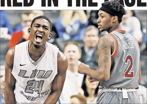  ?? Noah K. Murray ?? BLACKBIRD IS THE WORD: LIU Brooklyn’s Rauiquan Clark is all pumped up after a second-half basket, leaving Shamorie Ponds, who ultimately missed a shot to win it at the buzzer, wondering what is going wrong.