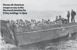 ??  ?? Heroes all: American troops on way to the Normandy beaches for D-Day landings in 1944