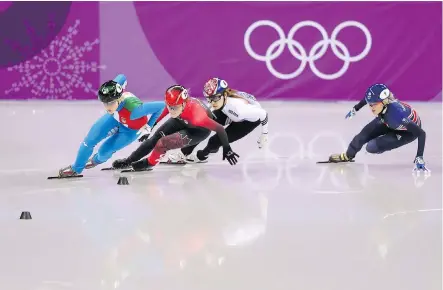  ?? RICHARD HEATHCOTE/GETTY IMAGES ?? Arianna Fontana of Italy, left, Kim Boutin of Sherbrooke, Que., Minjeong Choi of South Korea and Great Britain’s Elise Christie compete in the women’s 500-metre short-track speedskati­ng final Tuesday at Gangneung Ice Arena. Choi was later disqualifi­ed.