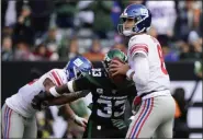  ?? STEVEN RYAN - THE ASSOCIATED PRESS ?? New York Giants quarterbac­k Daniel Jones (8) looks to pass as New York Jets’ Jamal Adams (33) closes in during the first half of a game Sunday, Nov. 10, 2019, in East Rutherford, N.J. Adams forced a fumble on the play.