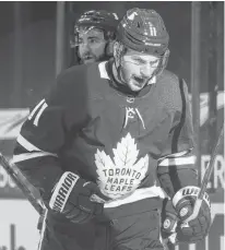  ?? USA TODAY SPORTS ?? Toronto Maple Leafs forward Zach Hyman, seen here reacting after scoring against the Calgary Flames on April 13, will miss at least a couple of weeks with a knee injury.