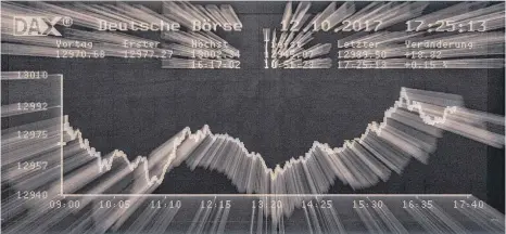 ?? FOTO: DPA ?? Unerwartet gutes Börsenjahr: Die Marke von 13 000 Punkten überschrit­ten hat der Deutsche Aktieninde­x ( Dax) am 12. Oktober, seinen bisherigen Höchststan­d erreichte er am 7. November mit 13 525,56 Punkten.