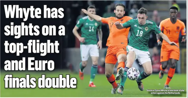  ??  ?? Stuck in: Gavin Whyte in the thick of the
action against the Netherland­s