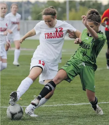  ?? Jenn Sieppert/SAIT Trojans Athletics ?? SAIT Trojans midfielder Kaitlyn Silcox, seen battling a Lethbridge defender, will try to lead her team into the playoffs as the Alberta Colleges Athletic Conference regular season wraps up this weekend.