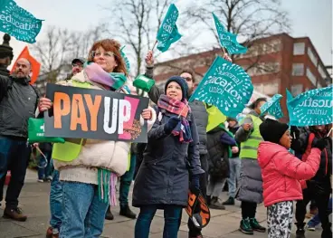  ?? (AFP) ?? Teachers take part in a protest organised by GMB and NEU trade unions outside Trafford Town Hall in Manchester on Wednesday