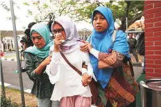  ?? Reuters ?? Relatives of passengers arrive at a crisis centre at Soekarno Hatta Internatio­nal airport near Jakarta.