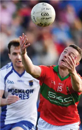  ??  ?? Leighton Glynn gathers the ball for Rathnew during the drawn Wicklow final against St Patrick’s. The addition of the replay caused chaos to the fixture list