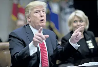  ?? ANDREW HARRER/ GETTY IMAGES ?? U.S. President Donald Trump speaks as he meets with county sheriffs during a listening session in the Roosevelt Room of the White House on Tuesday, in Washington, D.C.