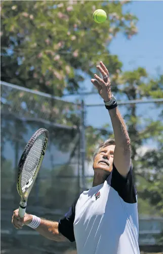  ?? LUIS SÁNCHEZ SATURNO/THE NEW MEXICAN ?? Jimmy Parker practices Friday at the Santa Fe Tennis and Swim Club. Parker has been competing in tennis for more than 60 years.