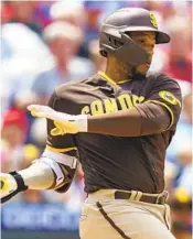  ?? ?? Padres second baseman Robinson Cano hits an RBI single to score Jurickson Profar in the fourth inning.