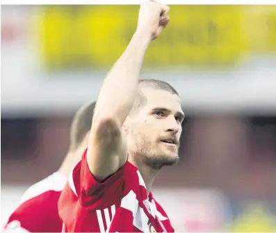  ??  ?? Salute Alex Gogic salutes the Hamilton fans as he punches the air at full-time