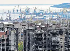  ?? ?? Mariupol, once a bustling, thriving key port, has been decimated by Russian shelling and war crimes