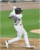  ?? AP ?? Sox shortstop Tim Anderson smacks an RBI single in the second inning.