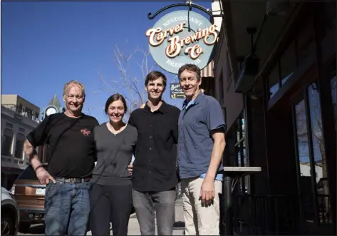  ?? ?? Brothers and former brewpub owners/operators Jim Carver, left, and Bill Carver, right, pose with Bill’s children and current owners/operators, Claire and Colin Carver, at Carver Brewing Co. in Durango on Nov. 18.