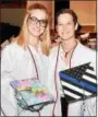  ?? JESI YOST — FOR DIGITAL FIRST MEDIA ?? Twins Abby and Emily Dlhopolsky display their decorated mortar boards. The sisters were part of Daniel Boone High School’s class of 2018.