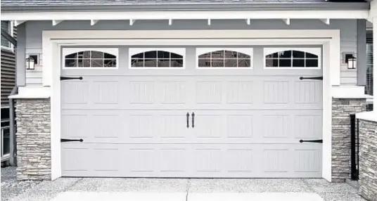 ?? Photo courtesy of Content That Works ?? Modern garage doors are safer and more secure than ever.