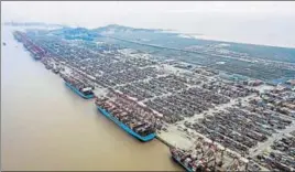  ?? BLOOMBERG ?? Container ships docked at the Yangshan Deepwater Port in Shanghai, China.