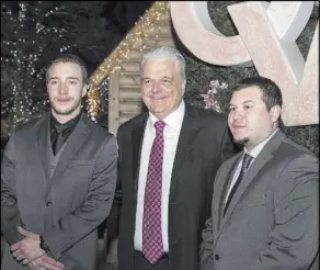  ?? Opportunit­y Village ?? Clark County Commission­er Steve Sisolak is shown with Mandalay Bay security officer Jesus Campos, right, and building engineer Stephen Schuck, left, on Thursday during the 26th annual Camelot gala at Opportunit­y Village’s Magical Forest.