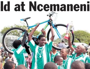  ??  ?? The man of the match, Andile Shange celebrates with his team mates after the very competitiv­e soccer match Larry Bentley