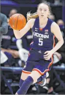  ?? Gary Landers The Associated Press ?? Connecticu­t guard Paige Bueckers, shown Feb. 20, is the third freshman named to The Associated Press women’s basketball All-america first team.