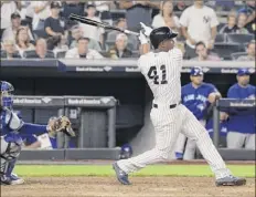  ?? Bill Kostroun / Associated Press ?? miguel Andujar hits a grand slam in the seventh inning to pull new York within a run. it was his second slam of the season.