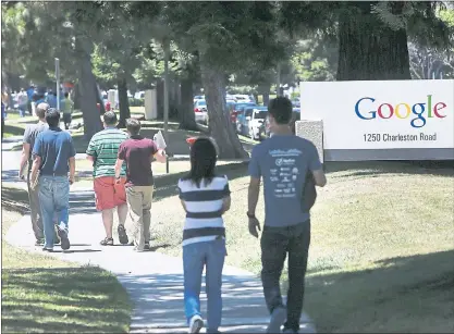  ?? STAFF FILE PHOTO ?? Google employees walk to and from the GooglePlex along Charleston Road in Mountain View in 2014. A student-led campaign against the firm’s controvers­ial military work aims to stop college graduates from interviewi­ng for open positions.