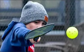  ?? Matt Freed/ Post- Gazette ?? Levi Duckworth, 11, plays pickleball with his brother in North Park in April.