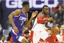  ?? Will Newton / Getty Images ?? Washington’s John Wall, dribbling past the Clippers’ Shai Gilgeous-Alexander, scored 30 points in the win.