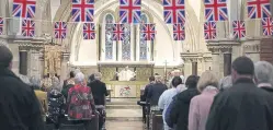  ?? ?? Canon Tom Kennar leads the Coronation Communion service at St Faith’s, Havant