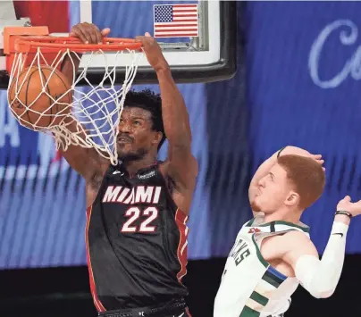  ?? ASSOCIATED PRESS ?? The Milwaukee Bucks couldn't stop Miami's Jimmy Butler, who scored 40 points in Game 1 of the Eastern Conference semifinals Monday night.