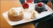  ??  ?? Del Frisco’s Double Eagle Steakhouse Celebratio­n Dessert features butter cake and chocolate souffle cake.