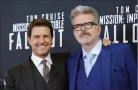  ?? PHOTO BY BRENT N. CLARKE — INVISION — AP, FILE ?? In this file photo, actor Tom Cruise, left, and director, writer, producer Christophe­r McQuarrie attend the premiere of “Mission: Impossible - Fallout” in Washington. McQuarrie didn’t set out to make the most action-packed “Mission” film in the...