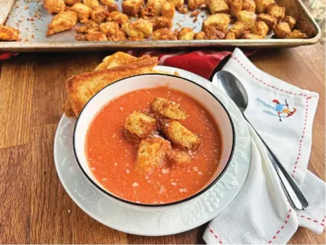  ?? PHOTO BY GRETCHEN MCKAY/PITTSBURGH POST-GAZETTE/TNS ?? Homemade tomato soup topped with crunchy, cheesy croutons is an easy mid-week meal.