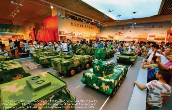  ??  ?? During the exhibition commemorat­ing the 90th founding anniversar­y of the PLA at the Military Museum of the Chinese People's Revolution, models of key PLA equipment in active service are on display alongside interactiv­e exhibits that simulate drills. VCG