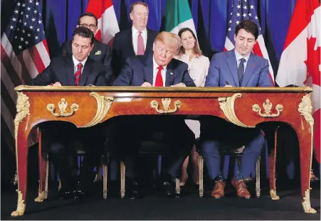  ?? PABLO MARTINEZ MONSIVAIS, THE ASSOCIATED PRESS ?? U.S. President Donald Trump is flanked by Prime Minister Justin Trudeau, right, and Mexican President Enrique Pena Nieto as the trio officially sign the U.S.-Mexico-Canada free trade pact in Buenos Aires, Argentina.
