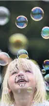  ??  ?? Bubble fun . . . Rosie Verhoef (2), of Dunedin, enjoys some bubbles.